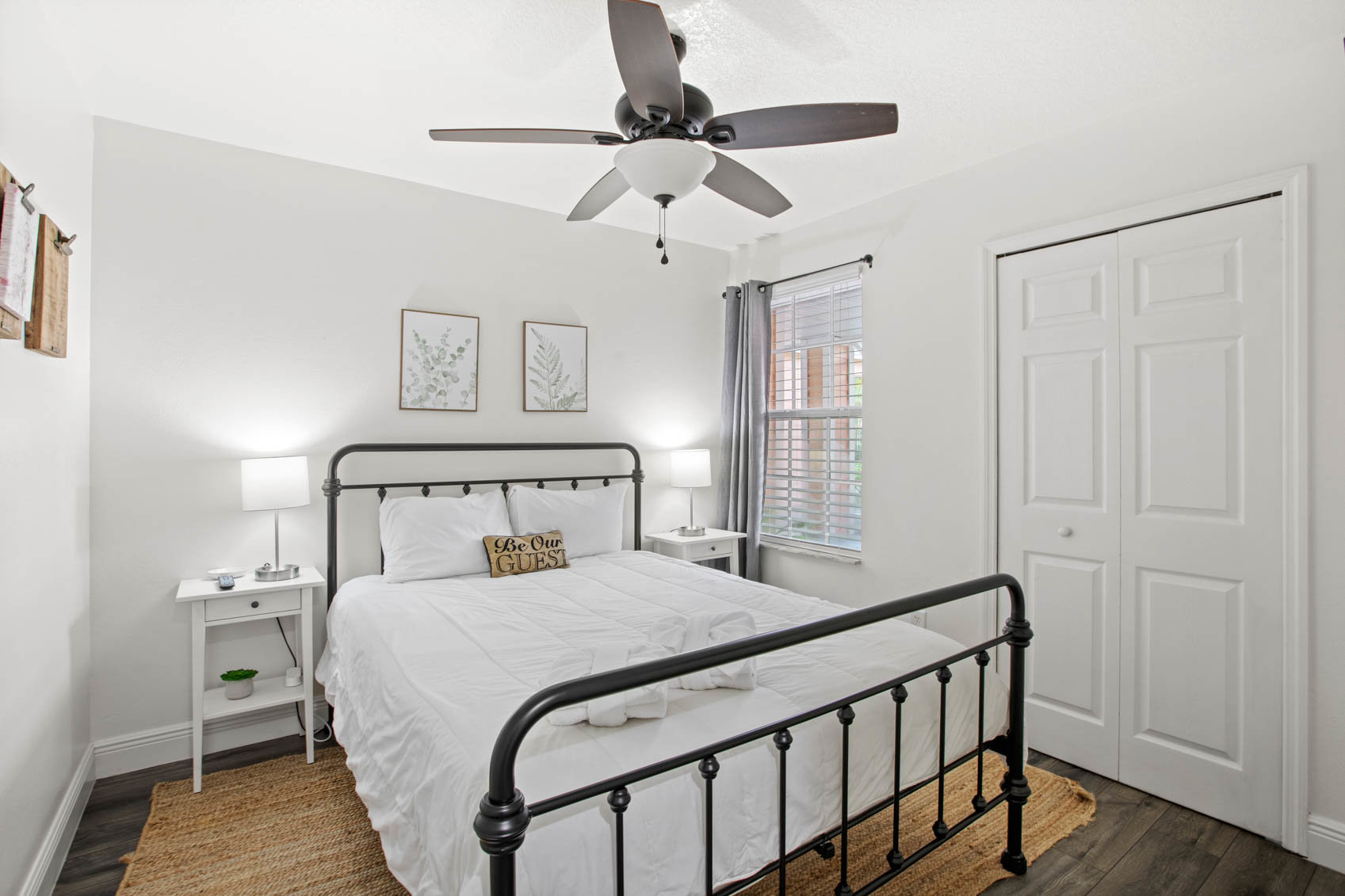 bedroom with white bed on black metal frame
